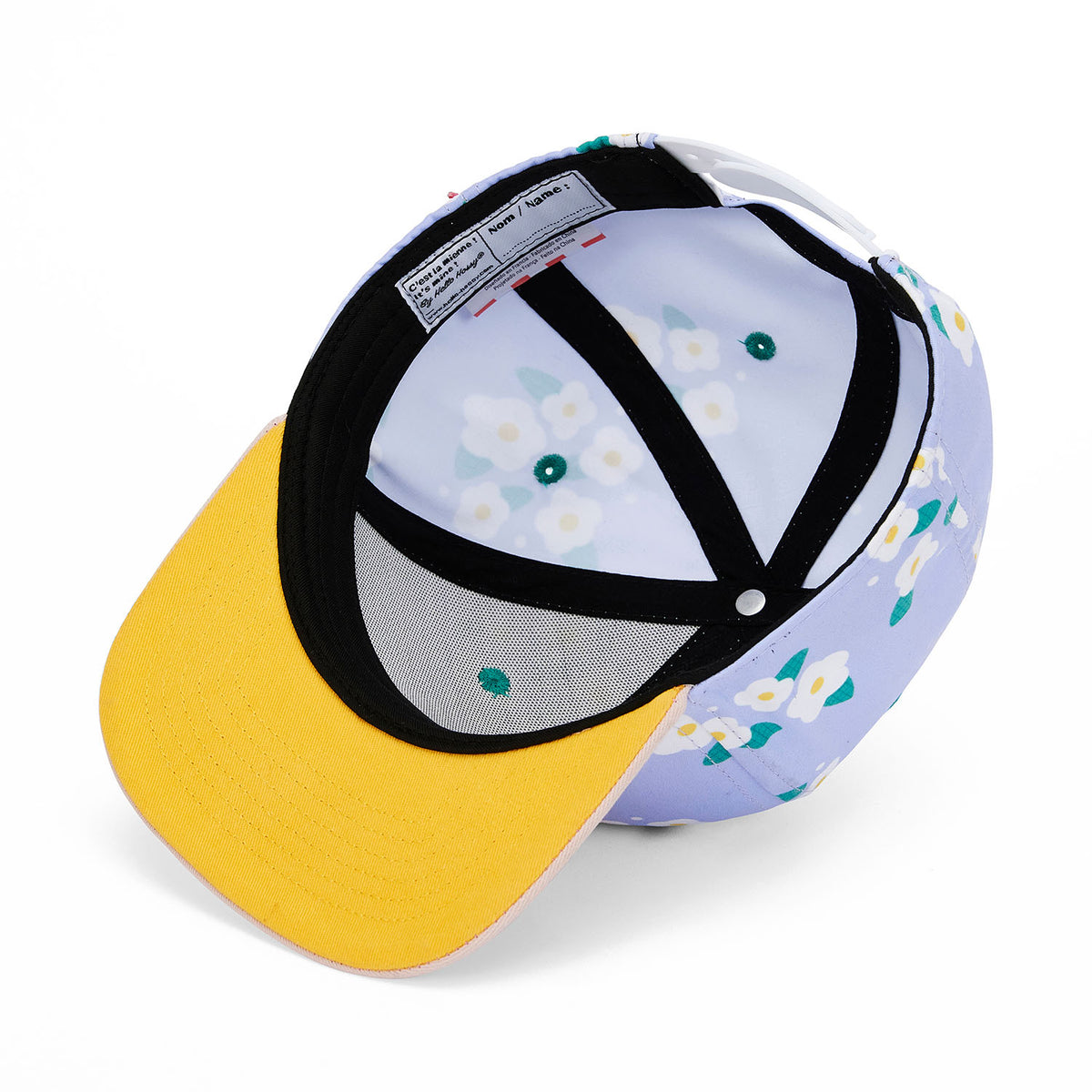 Gorra infantil con estampado de flores violeta, visera plana amarilla Hello Hossy