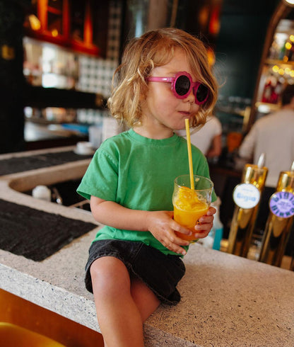 Lunettes de soleil enfant fuchsia monture fleur verres foncés Hello Hossy