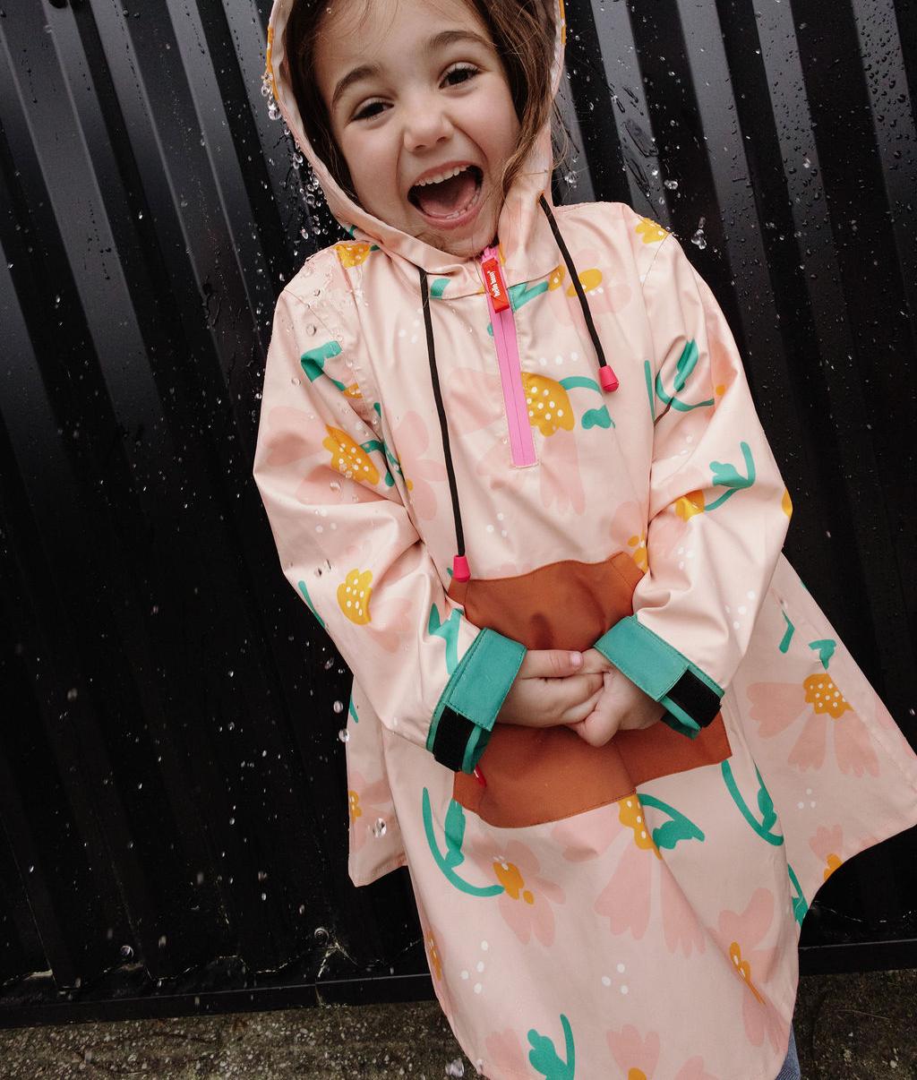 Poncho impermeable infantil rosa con estampado de flores Camel y verde Hello Hossy
