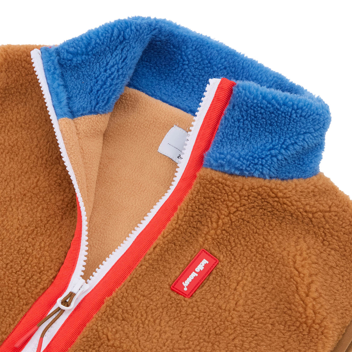 Chaqueta polar sin mangas infantil Camel con cuello azul y cierre de cremallera rojo Hello Hossy